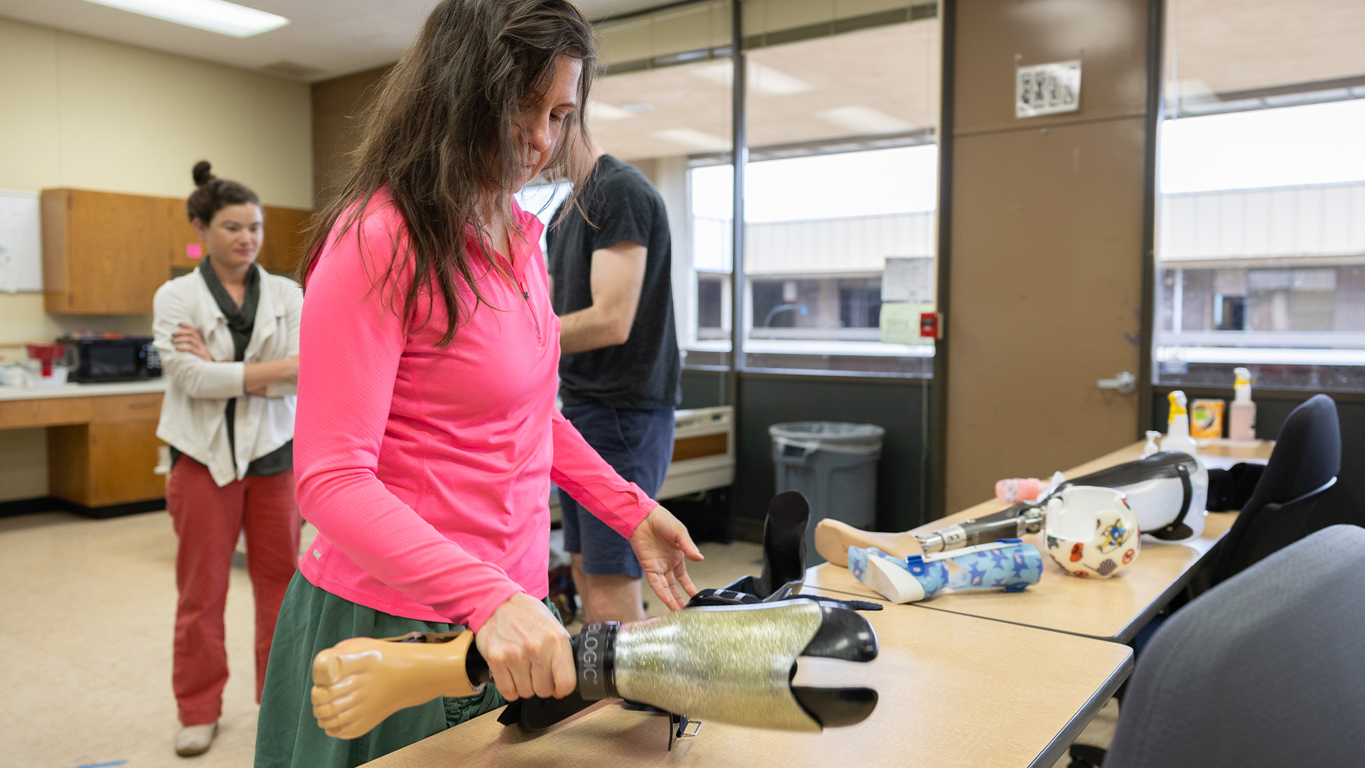 student handling physical therapy equipment