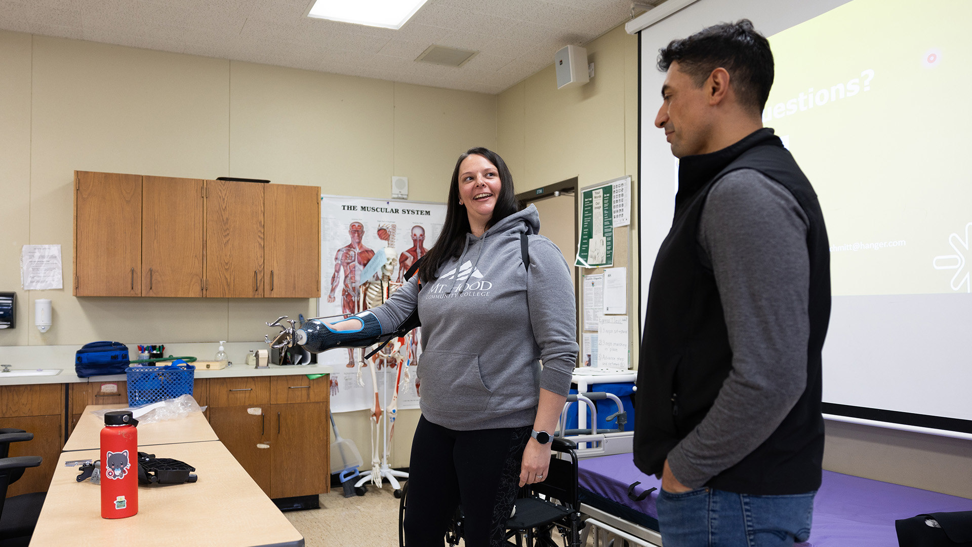 student handling physical therapy equipment