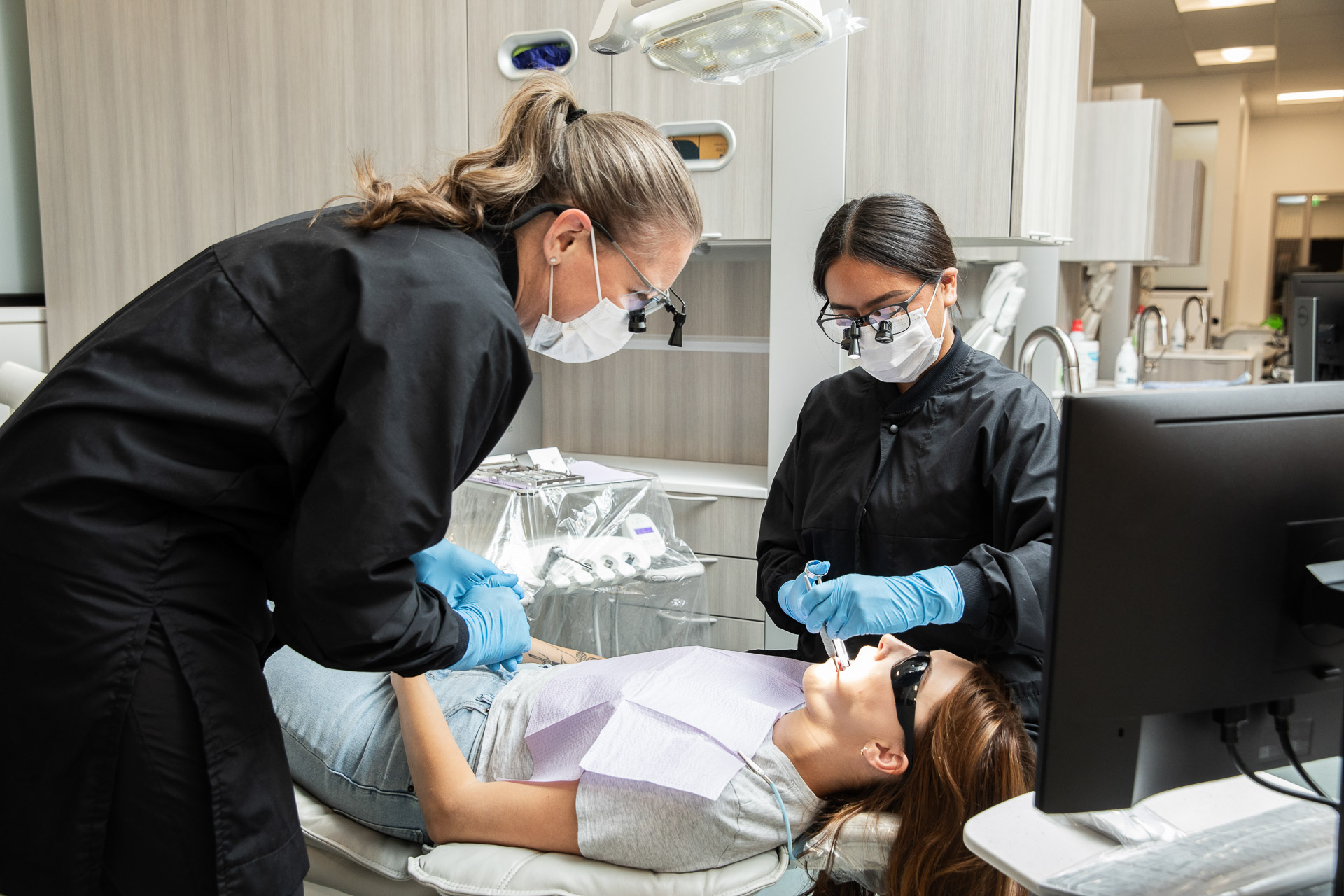 Hygienists working on patient