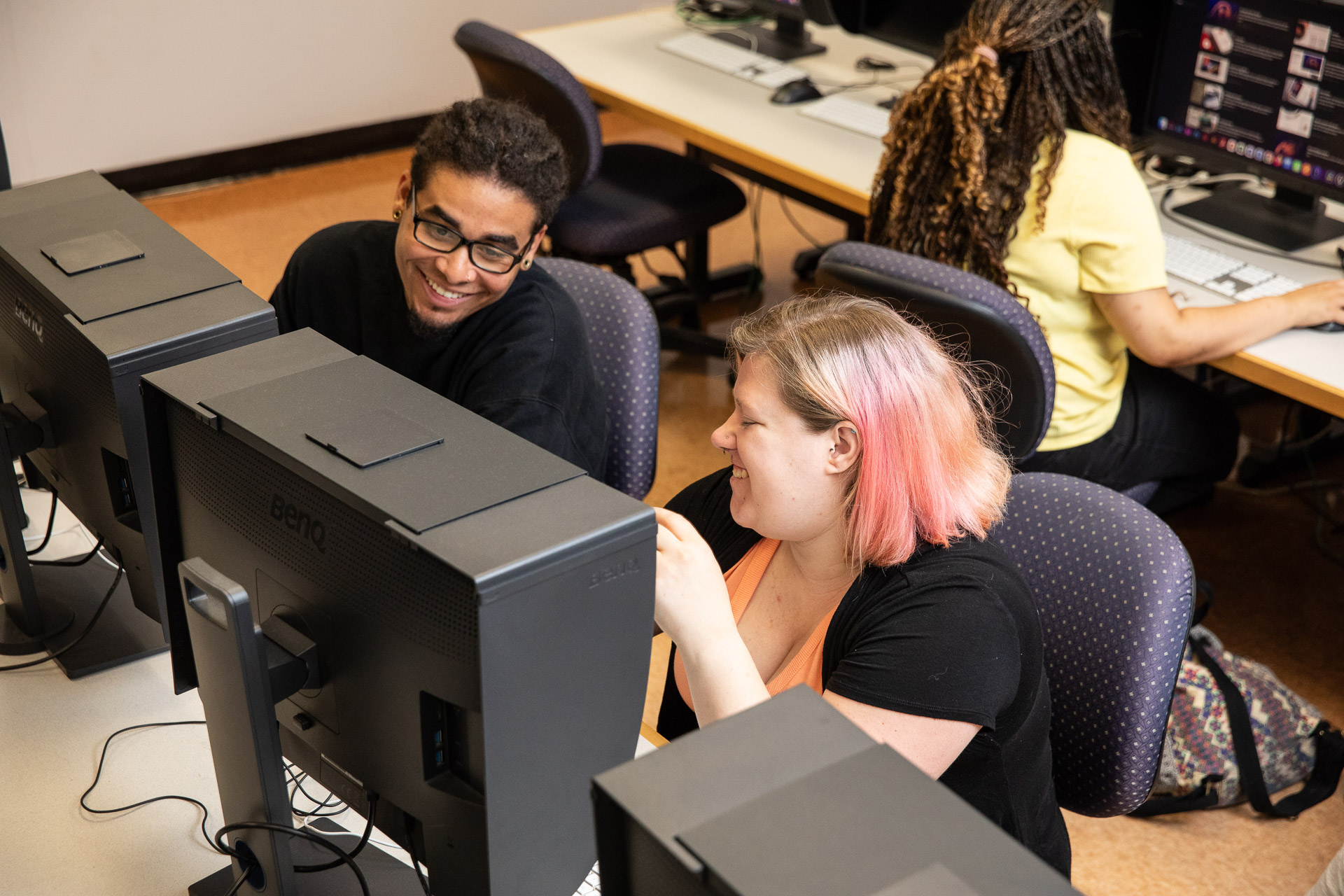 Students collaborating in the computer lab