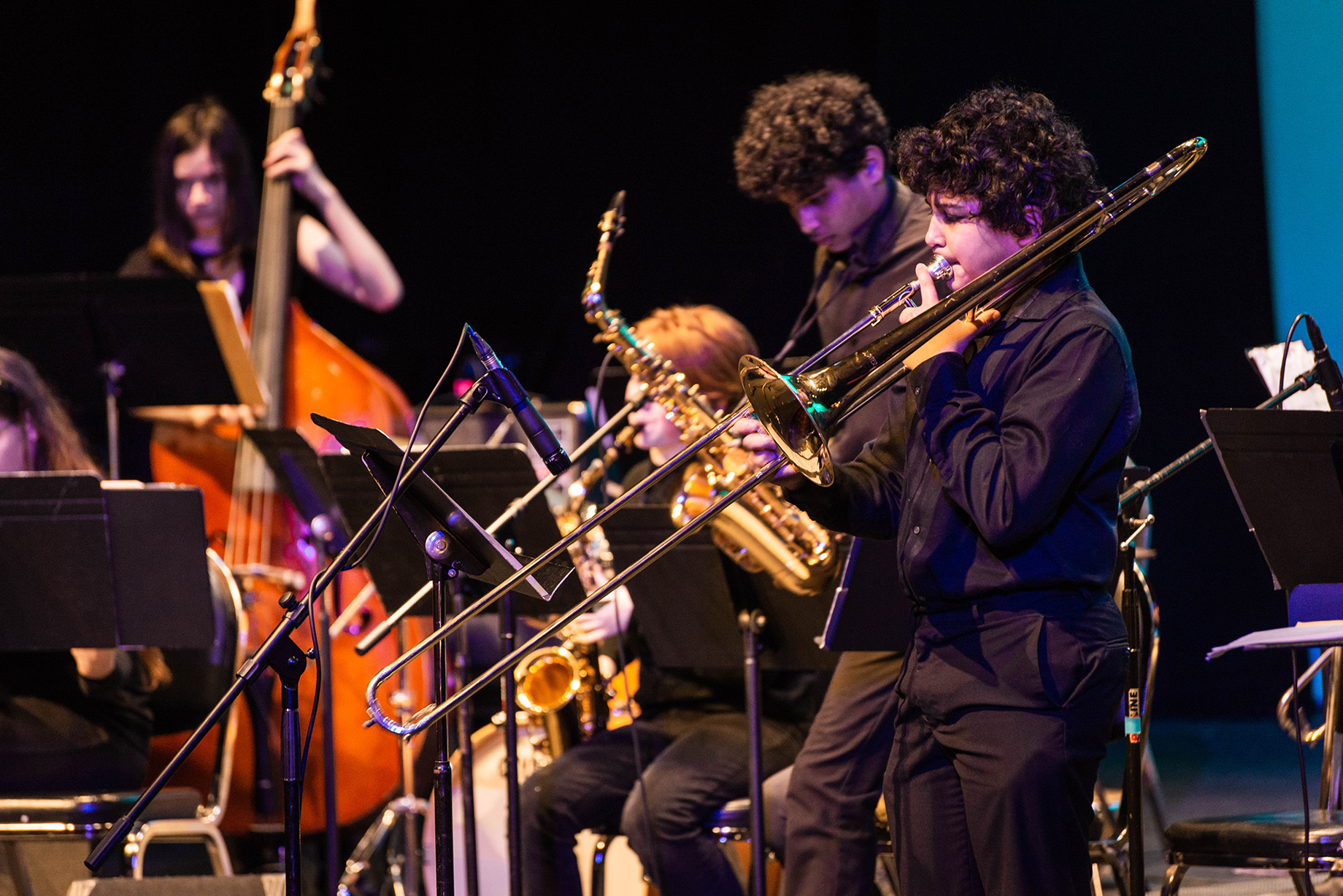 Musicians playing brass instruments on stage