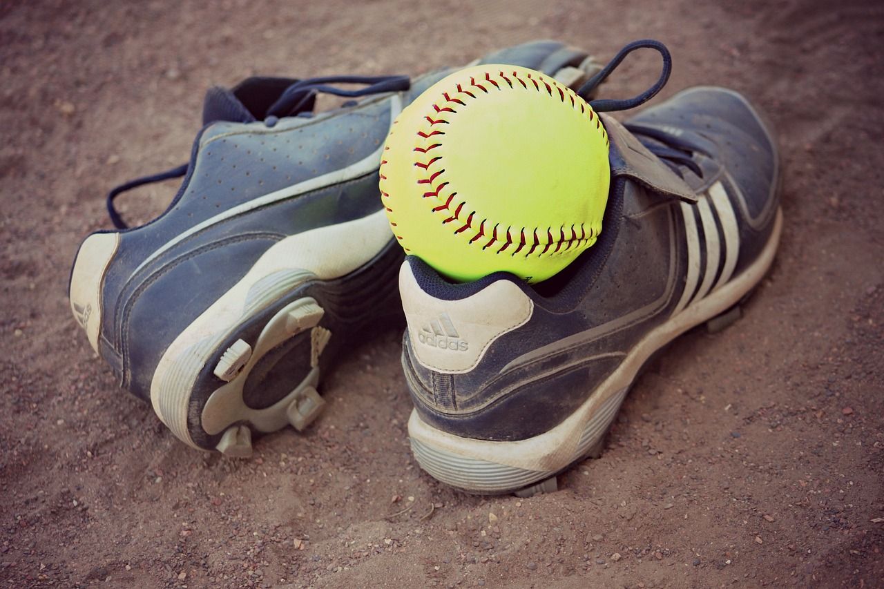 Softball in pair of cleats
