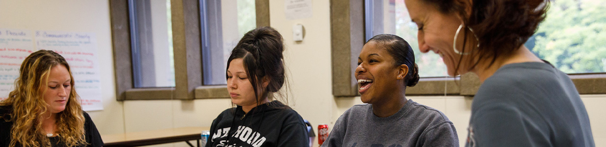 students laughing together in class