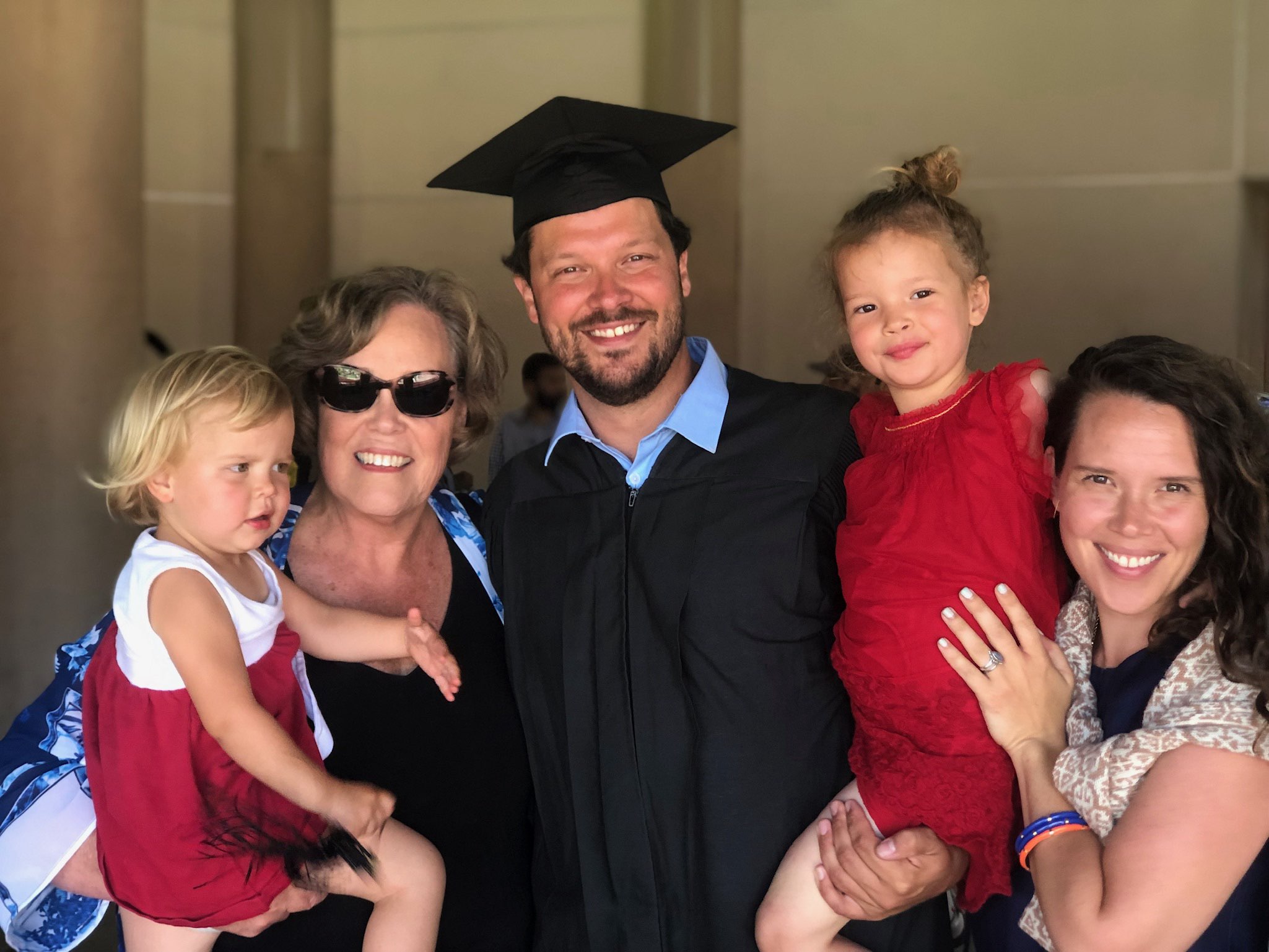Fred Krynen with his family at graduation. Daughters Wren and Elodie, mother-in-law Jane Baxter and wife Erin. 