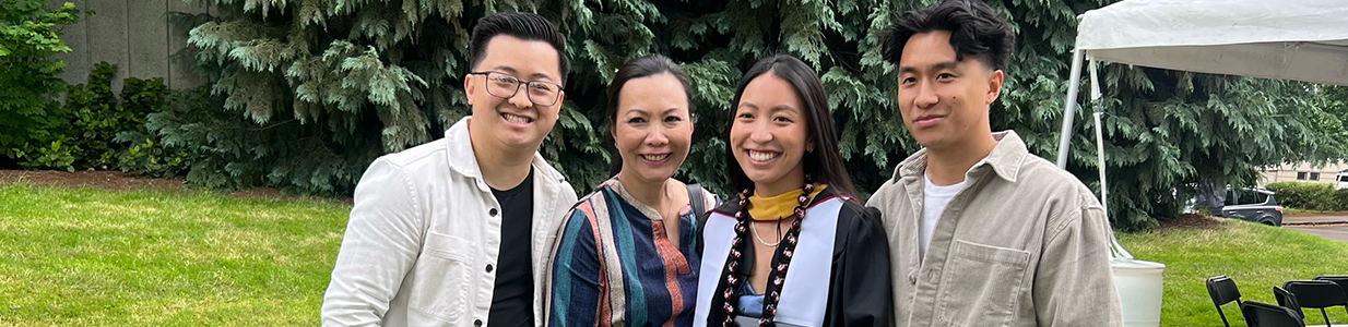 Trinh Nguyen standing with her children