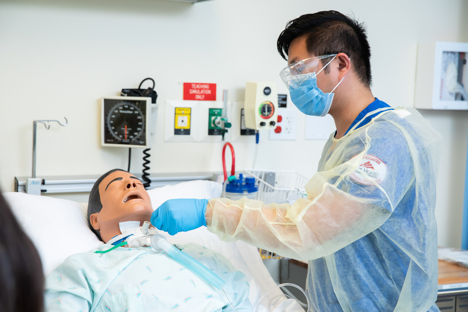 Health care student and training dummy